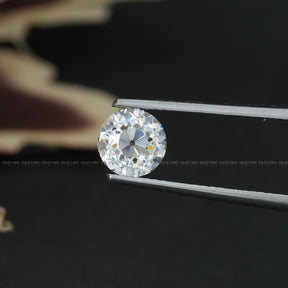 Tweezer view of Old European Round Cut Moissanite Stone