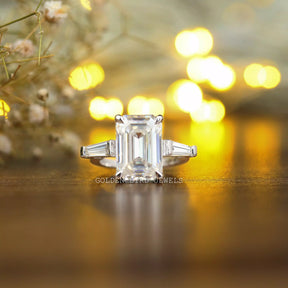 View of Three Stone Emerald Cut Moissanite Anniversary Ring In White Gold