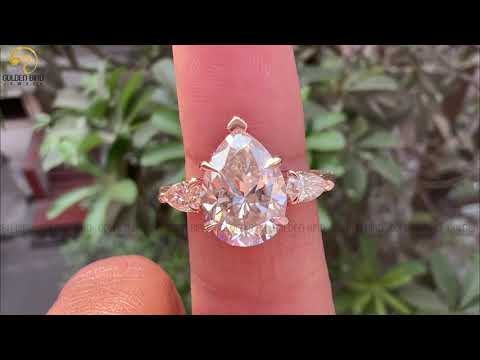 Youtube video of solitaire pear moissanite anniversary ring 