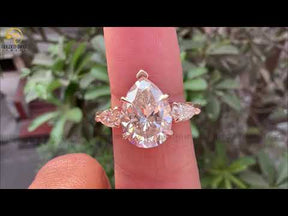 Youtube video of solitaire pear moissanite anniversary ring 