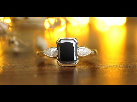 Youtube video of black radiant  cut  and pear shaped moissanite  ring in white side stones 