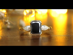 Youtube video of black radiant  cut  and pear shaped moissanite  ring in white side stones 